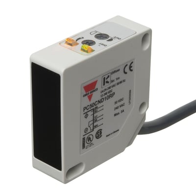 Carlo Gavazzi fotoaftaster med reflektionsprincip og 10 m rækkevidde, vist med rektangulært hus, sort front, kabel og indikatorer.
