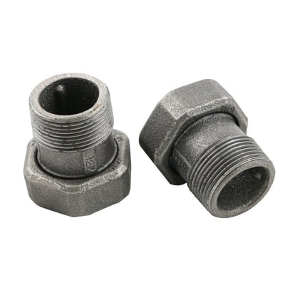 Nærbillede af Grundfos unionssæt i støbejern, viser 1½" omløber og 1 1/4" nippel med synlige gevind.