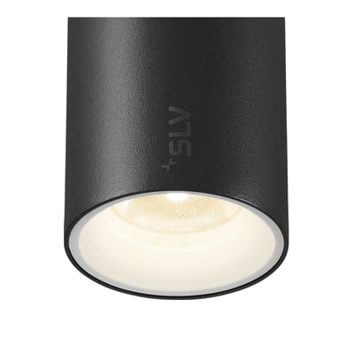 Tæt på SLV NUMINOS XS spot i sort, viser armaturets cylinderform og det integrerede lys med varmt skær.