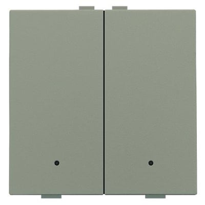Detalje af et bronze Niko Home Control 2-tryk, der fremhæver dets teksturerede overflade og diskrete LED-indikator.
