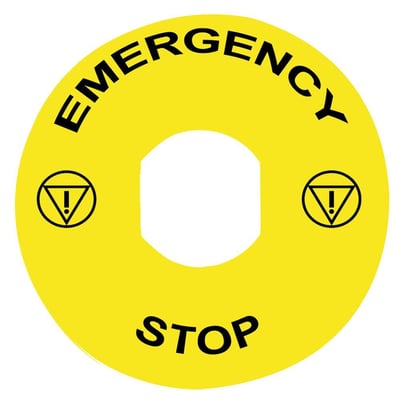 Detalje af Schneider Electric gult skilt Ø90mm, viser den gule farve og teksten "Emergency Stop" samt advarselssymboler.