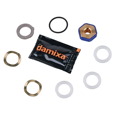 Komplet Damixa pakningssæt til S26/S29 tude med foliepakke og forskellige metal- og plastkomponenter på hvid baggrund.