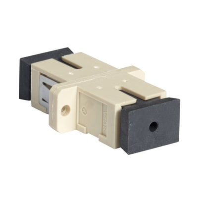 Lauritz Knudsen fiberadapter SC MM simplex i beige plast med sorte endestykker til sammenkobling af fiberkabler.