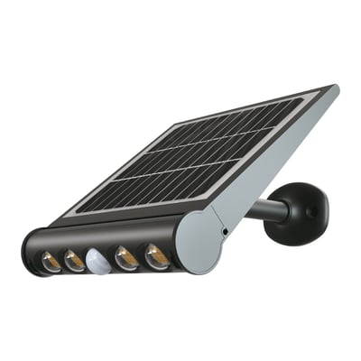 V-TAC 8W LED solcelle væglampe med bevægelsessensor, monteret på en væg, med kold lysfarve på 6500K.