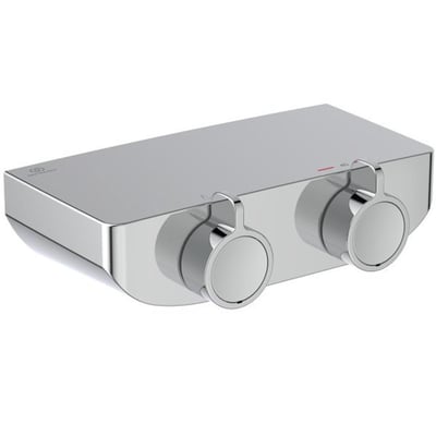 Frontbillede af Ideal Standard OX THM brusearmatur i krom med to greb, der viser den polerede messing og funktioner.