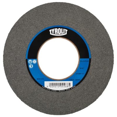 Tyrolit vlies-afgratningsskive CW Dbw 152 x 25 x 25,4 mm, 8 C FINE P, med mærket Tyrolit tydeligt synligt på den grå skive.