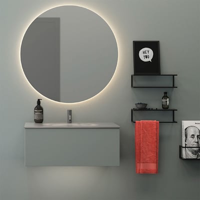 Dansani YOU Underlight oplyser et moderne badeværelsesmøbel med et stort rundt spejl og integreret LED-lys.