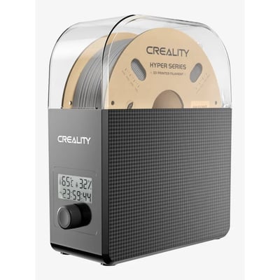 Creality Filament Dry Box 2.0 med en rulle gråt 3D-printerfilament indeni, viser temperatur og fugtighedsdisplay.