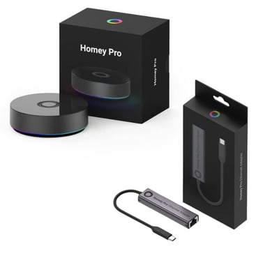 Athom Homey Pro (2023) smart home hub og Homey Pro Ethernet adapter bundle i æske på hvid baggrund.