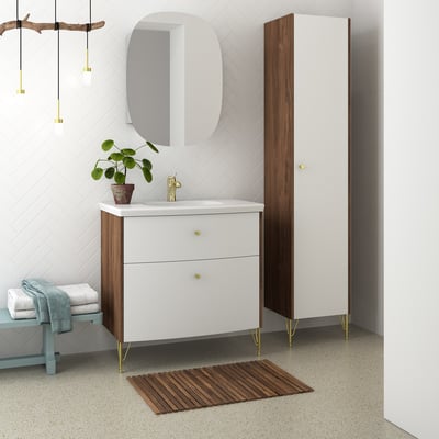 Dansani YOU støtteben i vintage messing, monteret på et moderne badeværelsesskab med hvid bordplade og trælåger.