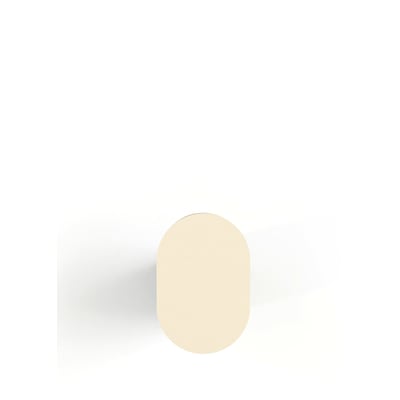 En enkelt beige Metallbude Pali knage set ovenfra, med en afrundet oval form på en hvid baggrund.