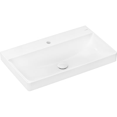 Hansgrohe Xelu Q håndvask i hvid porcelæn set skråt fra siden, med tydeligt hanehul og blank krom bundventil.