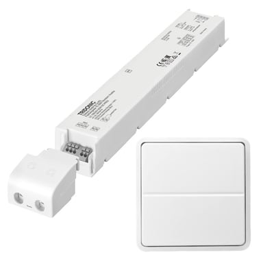 Jumitech 150W 24V LED driver og et trådløst Fuga tryk er vist sammen på hvid baggrund.