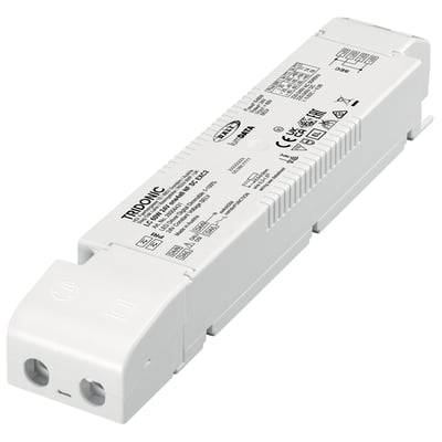 Tridonic LED driver LC 60W 24V DALI-2 one4all NF SC EXC2 SP i hvidt plast med tydelig mærkning og tilslutningsklemmer på en hvid baggrund.