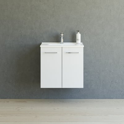 Dansani Mido mini møbelpakke i hvid højglans med to låger og Amber Mini porcelænsvask monteret på væg foran grå betonvæg.