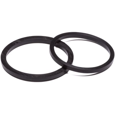 To sorte Viton-pakninger til levnedsmiddelfittings, DN40, med fokus på materialets tekstur og runde form.