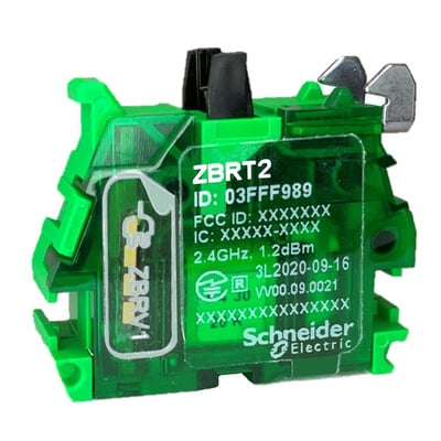 Nærbillede af Schneider Electric ZBRT2 senderens mærkning, der viser ID, frekvens og produktionsdato.