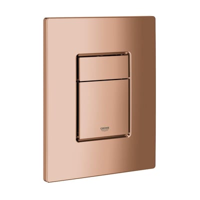 Nærbillede af Grohe Skate Cosmopolitan betjeningspladens blanke Warm Sunset overflade, med Grohe logo diskret placeret.