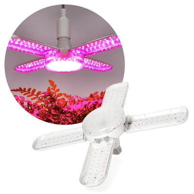 Hvid Kobi PLANTY LED-grolyspære med E27-sokkel og fire lysarme, vist med lilla lys over planter.