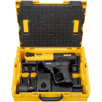 REMS Akku-Press 14V ACC liggende i en gul L-Boxx med skumindlæg, inklusive batteri og lader.