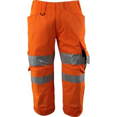 Fluorescerende orange Mascot Safe Supreme knickers med reflekser og knælommer. Smudsafvisende Teflon-behandlet materiale.