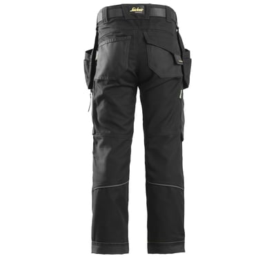 Bagfra af Snickers Workwear FlexiWork junior arbejdsbukser i sort, viser forstærkede knæ og detaljer på bagsiden.