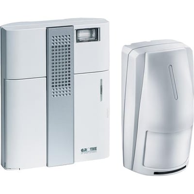 Grothe Mistral 300 BM trådløs klokke og bevægelsesmelder i hvid plast, vist sammen på hvid baggrund.