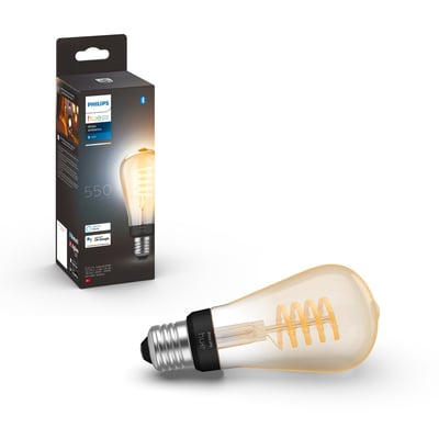 Philips Hue White Ambiance E27-filamentpære med synligt snoet filament, vist sammen med sin emballage.