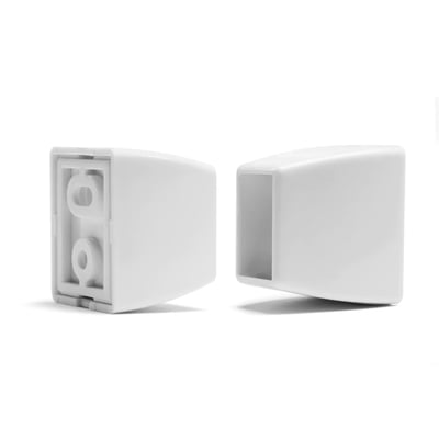 To hvide HeFe bendy forhængsstang endestykker, der viser det indre montagehul og den ydre glatte overflade.