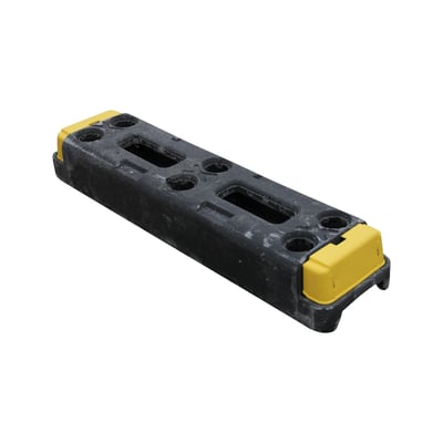 Gummifod til byggepladshegn fra Materielhuset, 77x12 cm, med gule endestykker og sorte gummi-materiale.