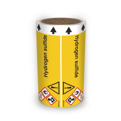 DENFOIL-rørmærke til hydrogen sulfide på 5 meter rulle med gul mærkning, engelsk tekst, sorte flowpile og faresymboler.