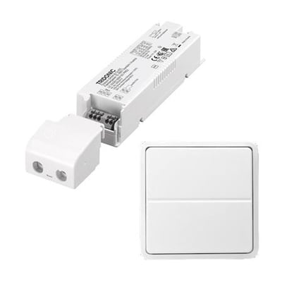 Lauritz Knudsen 35W/24V LED-driver og trådløst tryk til FUGA, vist samlet på hvid baggrund.