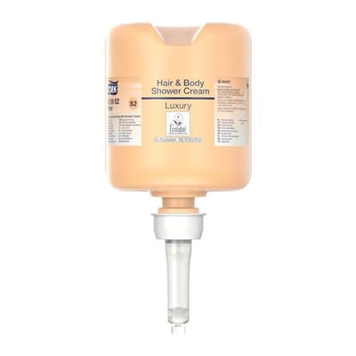 Tork Luksus Hair & Body Mini flydende sæbe i en ferskenfarvet beholder med dispenserpumpe.