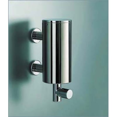 Vola T10JR-40 sæbedispenser i børstet stål monteret på en væg, viser den kompakte cylinderform og praktiske pumpefunktion.