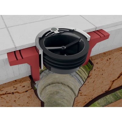 Green Drain membran-lugtlukke, 32-35 mm, installeret lodret i afløb i murstensvæg og gulv.