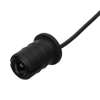 Sort Carlo Gavazzi fotoaftaster Ø18 med krave, set skråt forfra med optisk linse og fast kabel.