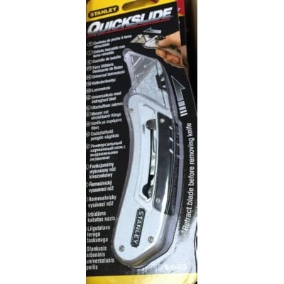 Stanley Quickslide arbejdskniv i blisterpakning med flersprogede instruktioner og bælteklips.