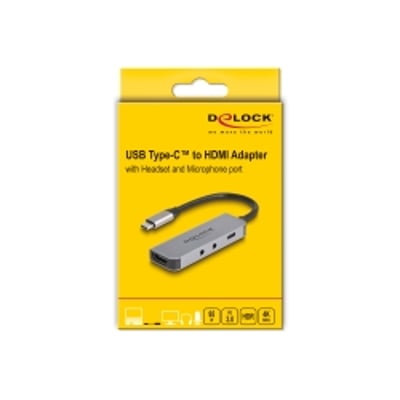 DeLock USB-C-adapter til HDMI med headset- og mikrofonport ses på den gule produktemballage.