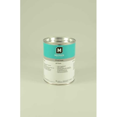 Molykote TP-42 pasta i 1 kg dåse med blågrøn etikette og et "M" logo på en lysegrå baggrund.