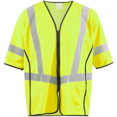 Mascot trafikvest i gul, klasse 3, med refleksdetaljer og sort kant, vist i neutralt lys med let skygge.