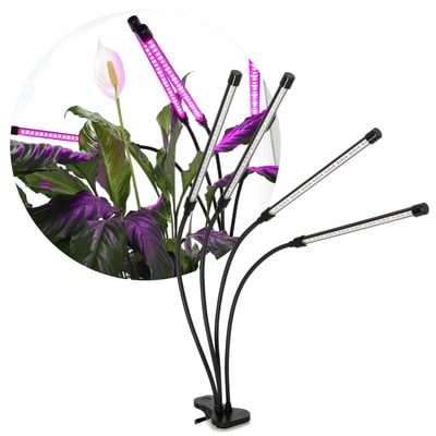 Kobi VITARO 4 CLIP plantelys med fire fleksible lyselementer og sort klemme står ved grønne planter med lilla lys.