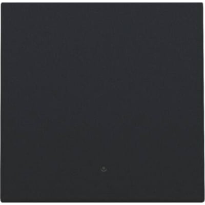 Niko smart tryk tangent i sort med integreret linse til LED indikator, monteret på en mørk baggrund.