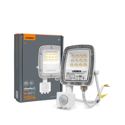 Videx LED-projektør på 10 W med PIR-bevægelsessensor ses forfra sammen med den grå og orange emballage.