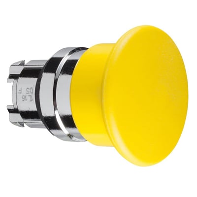 Nærbillede af Schneider Electric Harmony Style 4 gul paddetryk, Ø40 mm, viser fjeder-retur mekanismen og ZB4BC5 modelnummer på bagsiden.
