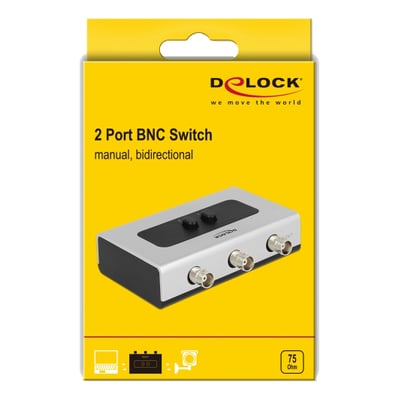 Emballagen til DeLock manuel, bidirektionel BNC-switch med to porte viser en illustration af den sølvfarvede switch.