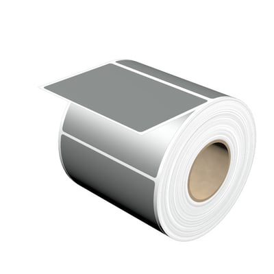 Rulle med sølvfarvede komponentmærker fra Weidmüller, model THM MT30X 89/60 SI, vist med et mærke trukket ud.
