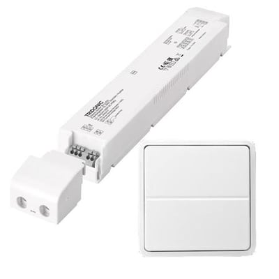 Lauritz Knudsen 100W/24V LED driver med trådløst tryk til Fuga, vist med tilhørende hvid, kvadratisk tryk-enhed.