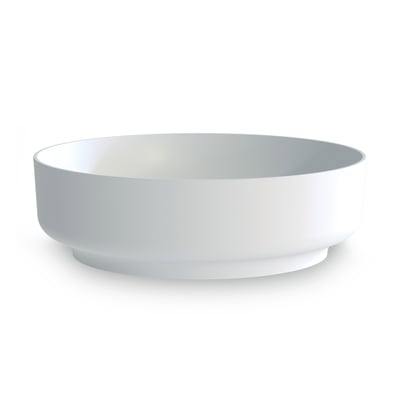 Sideprofil af Svedbergs fritstående håndvask i mat hvid akryl, der viser dens elegante, runde form og bordstående design.