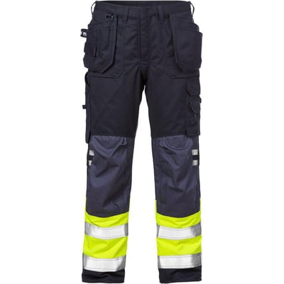 Kansas håndværkerbukser i mørkeblå med hi-vis gul og reflekterende detaljer på benene. Bukserne har flere lommer.