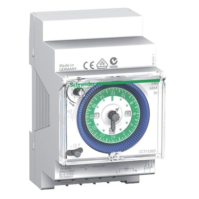 Detaljebillede af Schneider Electric mekanisk kontaktur IH, der viser den grønne 24-timers urskive med hvide tidssegmenter og sort viser.